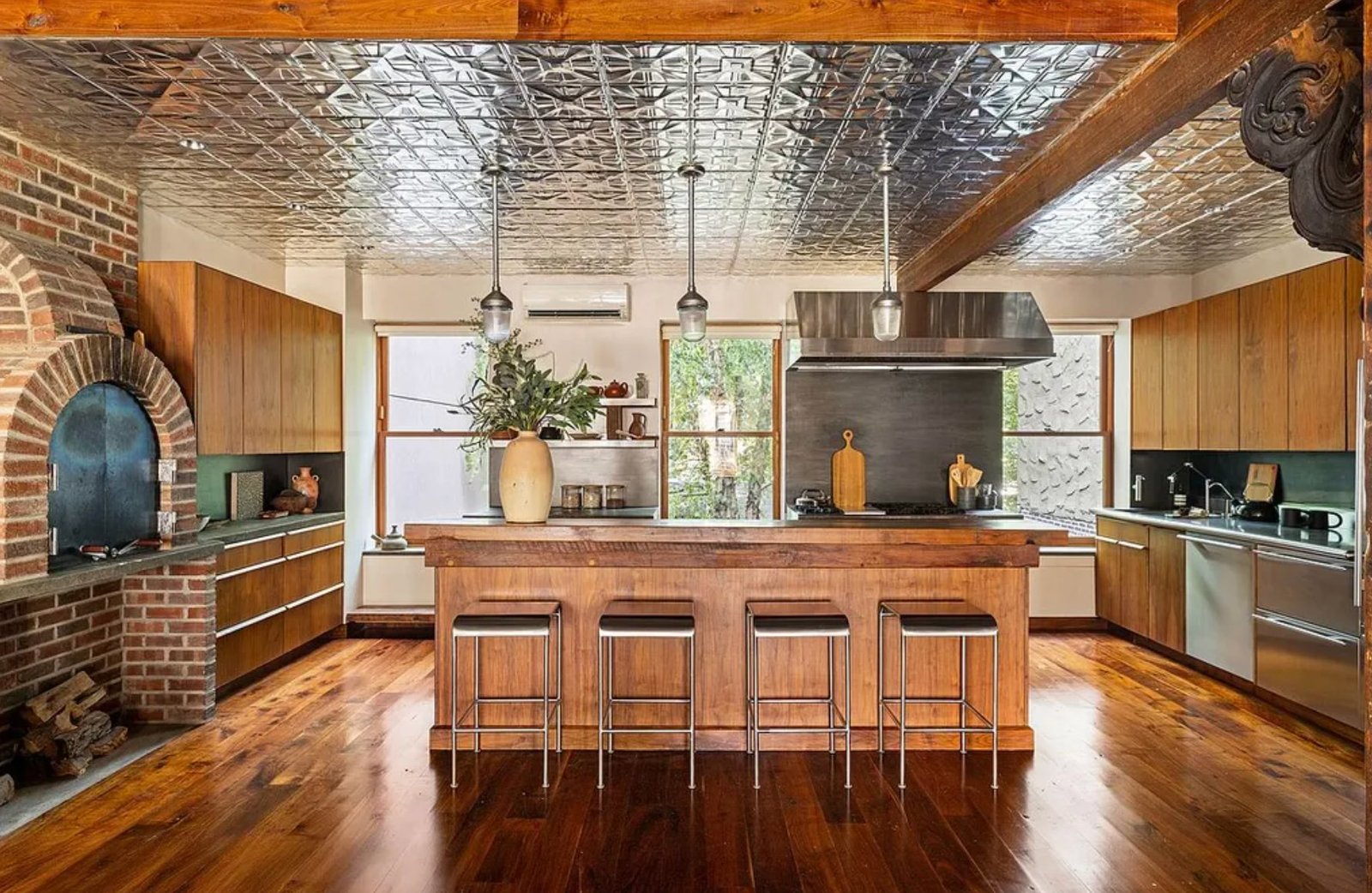 Kitchen with pressed tin ceiling and a wood-burning pizza oven