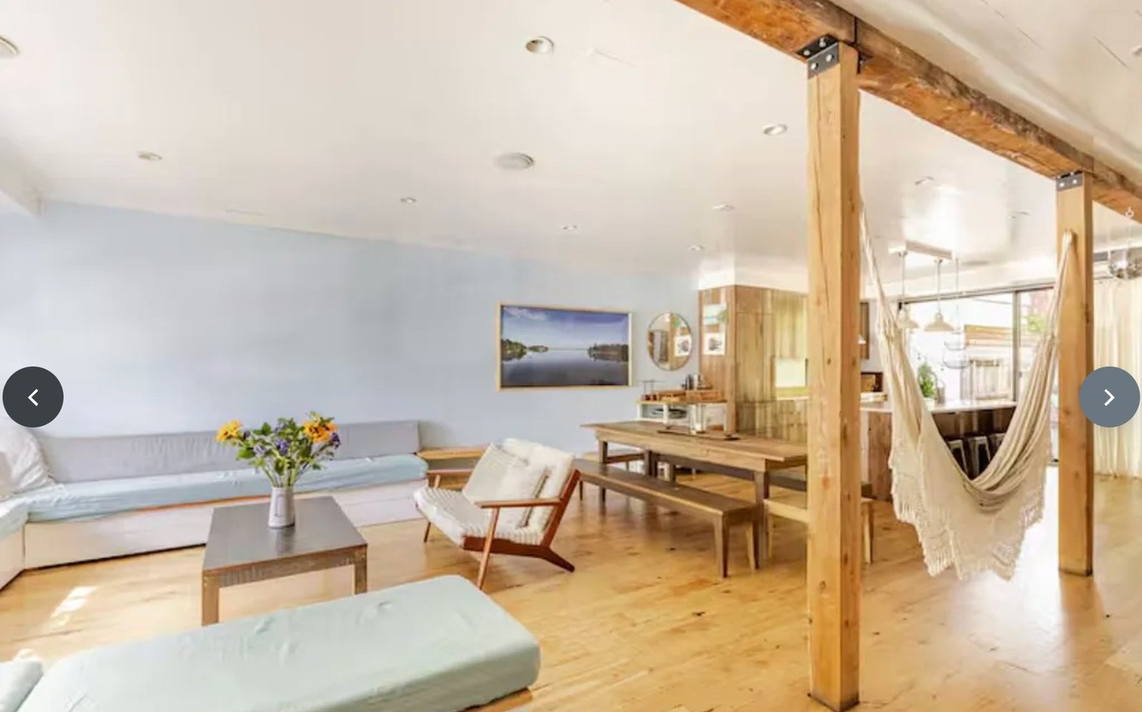 Open floor plan with dining table and hammock at 589 Union Ave